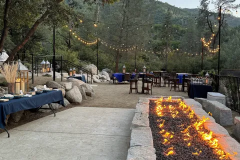 river park venue with event set up and fire pit going 