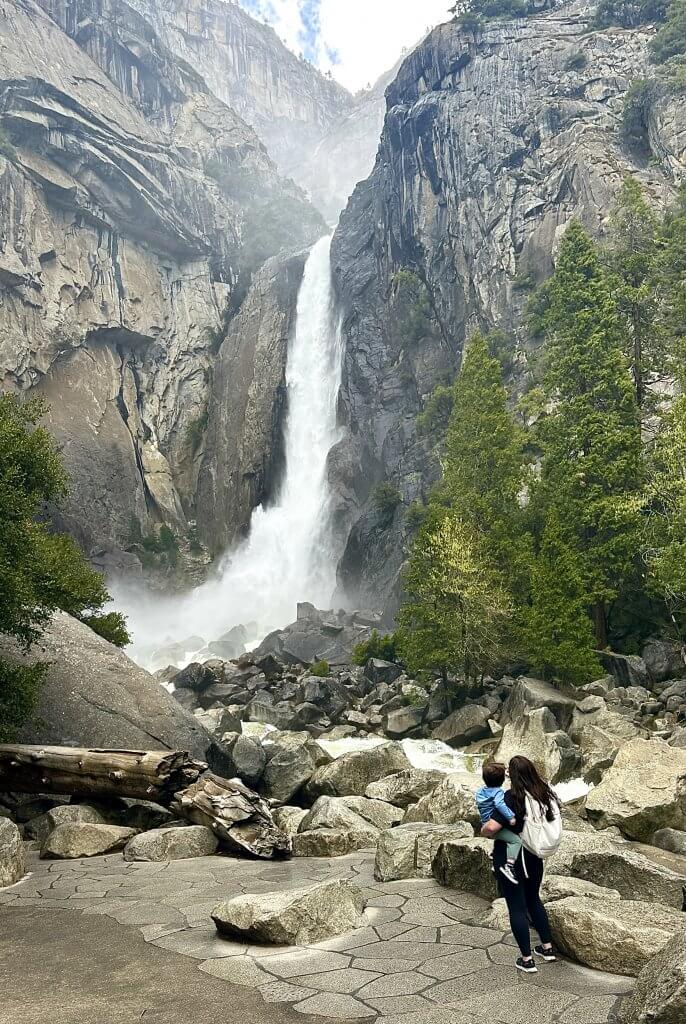 Mom and child looking at waterfall